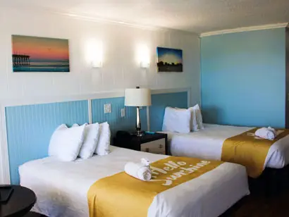 Two double beds in an ocean-view guest room at Blue Heron Motel